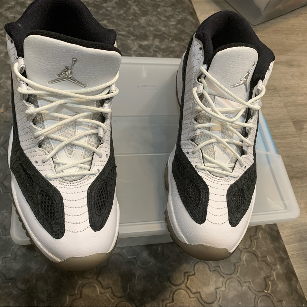 White & black Retro 11 ie low Jordan size 11.5. Lightly worn looks brand new.